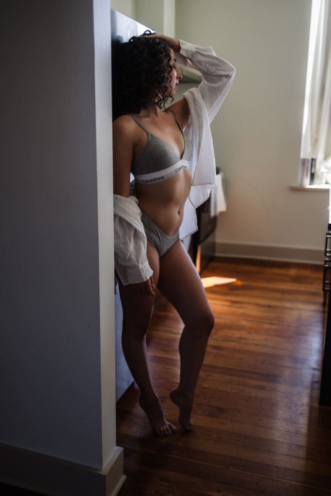 woman leaning on fridge during tasteful and classy knoxville boudoir photography session