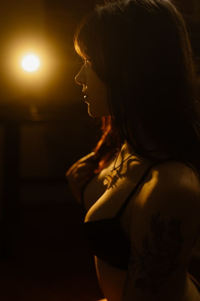 woman's profile during golden hour boudoir session at the lightfoot studio in knoxville